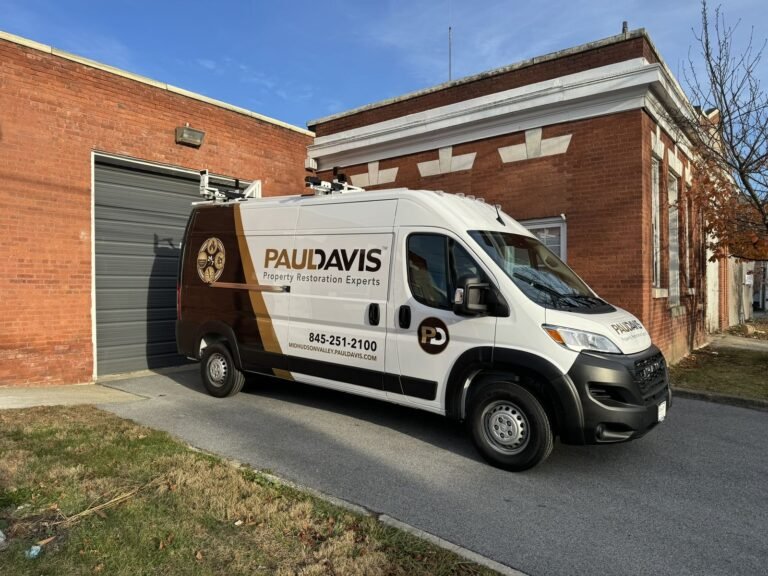 Paul Davis Restoration of the Mid-Hudson Valley emergency response van parked outside a commercial restoration property in New York ready for 24/7 water, fire, and mold damage restoration services.